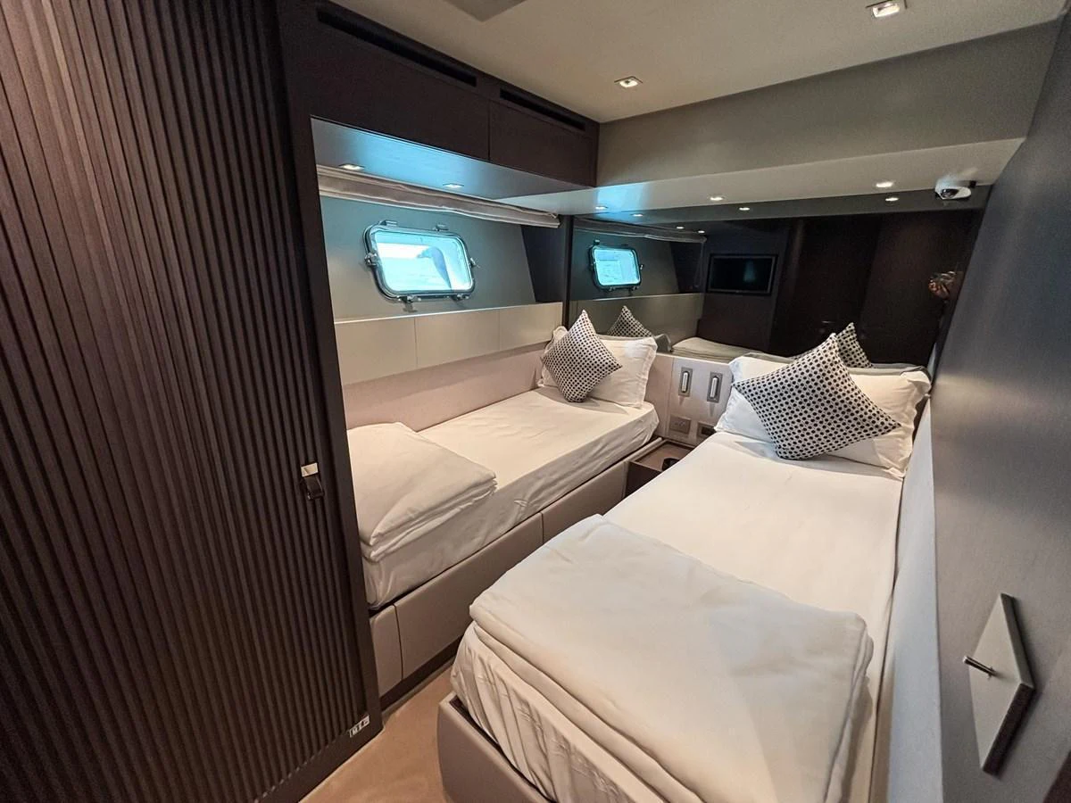 The guest stateroom offers a cozy and modern sleeping area with twin beds and stylish decor. aboard SANLORENZO SX88 Yacht for Sale