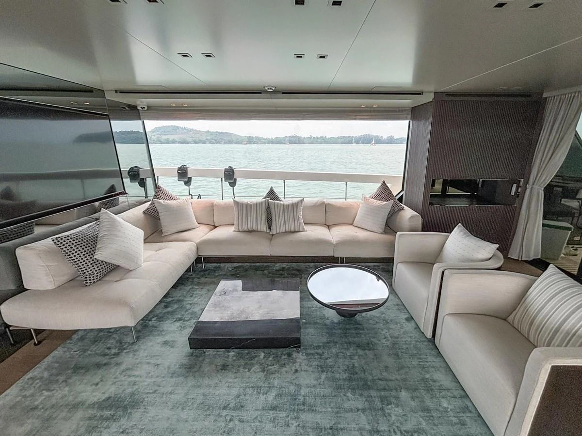 The salon features a spacious seating area with large windows offering panoramic views of the water. aboard SANLORENZO SX88 Yacht for Sale