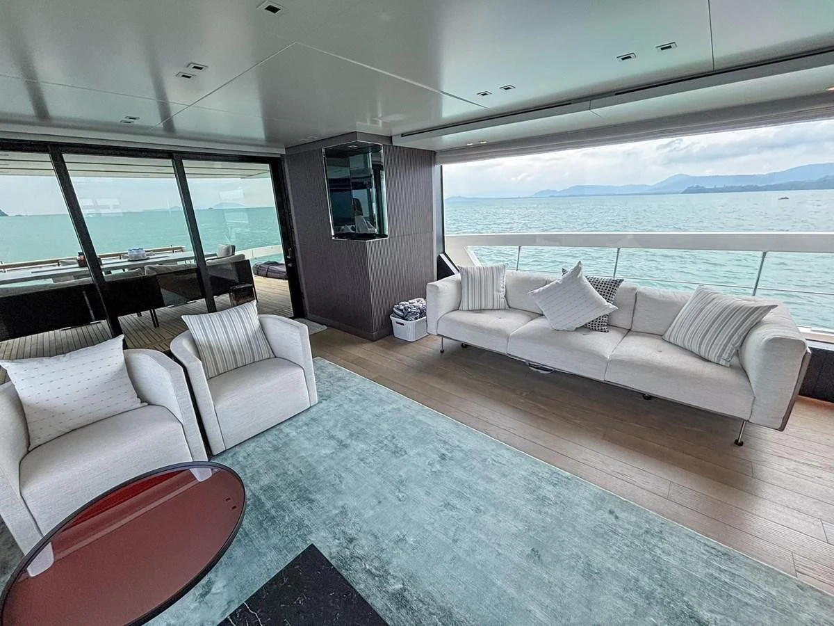 The salon offers a spacious and comfortable seating area with panoramic ocean views. aboard SANLORENZO SX88 Yacht for Sale
