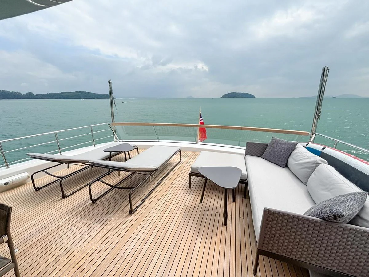 The sundeck offers a relaxing space with lounge chairs and a sofa overlooking the water. aboard SANLORENZO SX88 Yacht for Sale