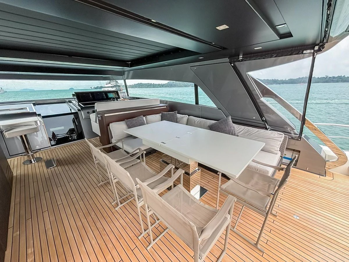 The aft deck features a spacious dining area with a large table and comfortable seating, perfect for alfresco dining. aboard SANLORENZO SX88 Yacht for Sale