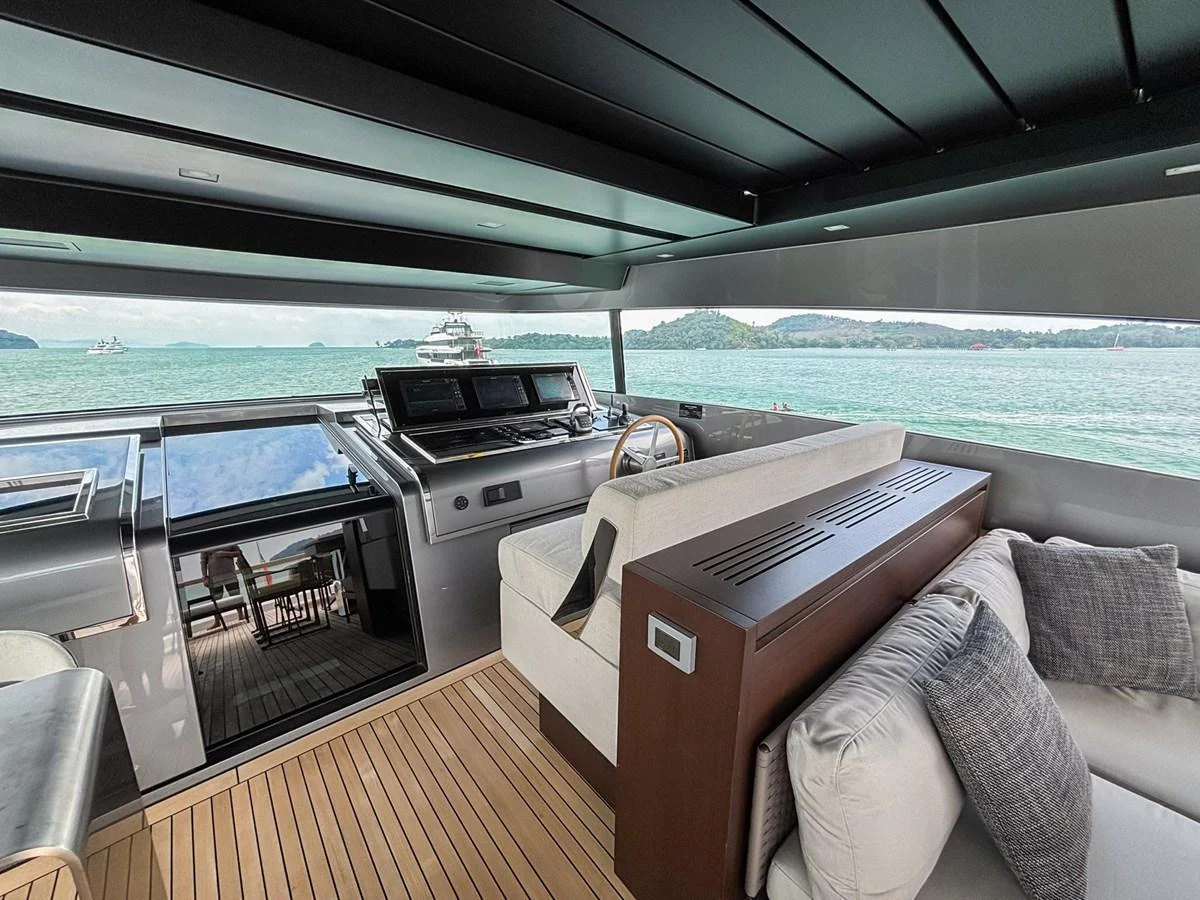 The helm area offers a spacious and modern design with a comfortable seating arrangement and panoramic views of the sea. aboard SANLORENZO SX88 Yacht for Sale