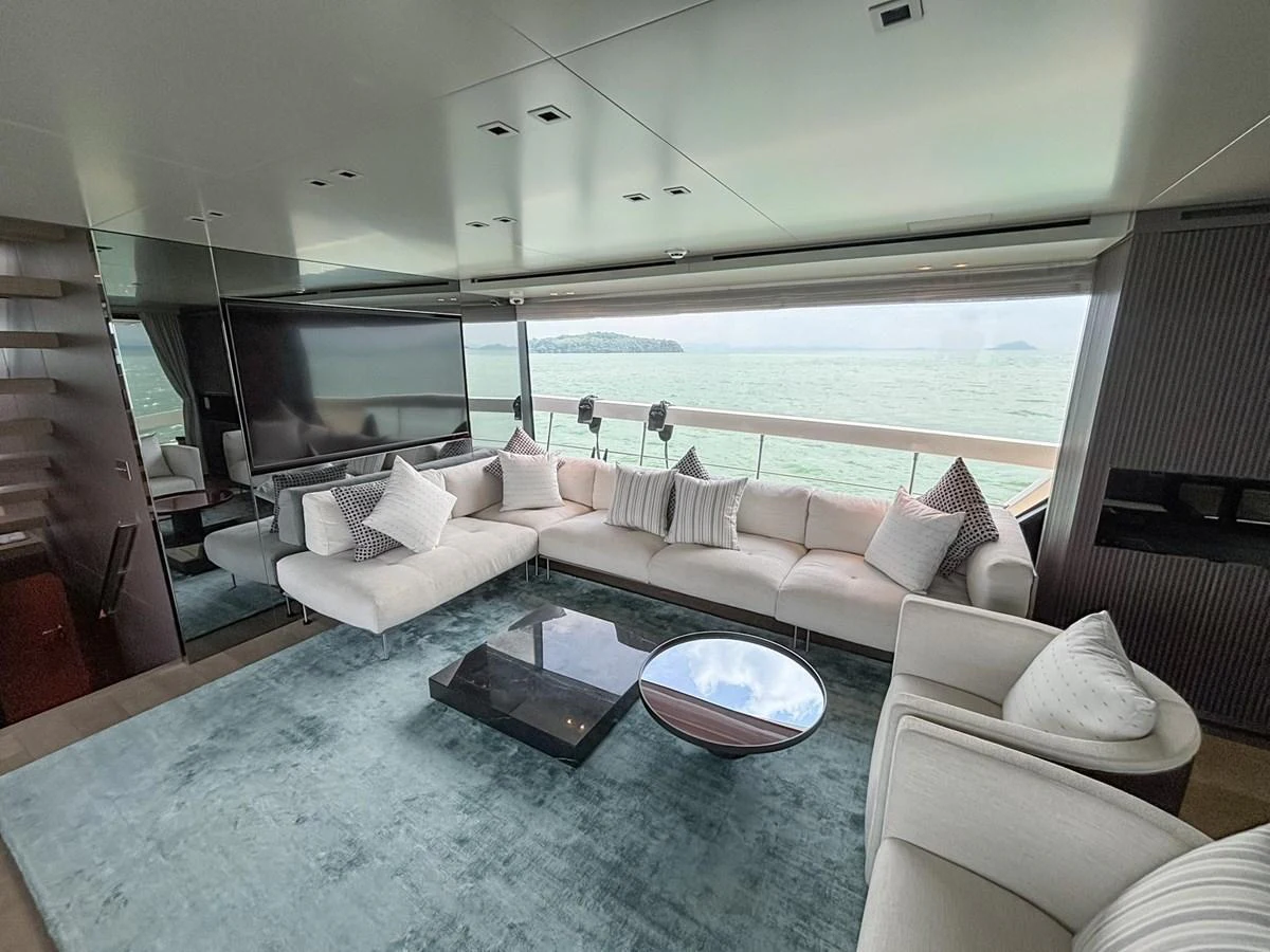 The salon features a spacious seating area with large windows offering stunning sea views. aboard SANLORENZO SX88 Yacht for Sale