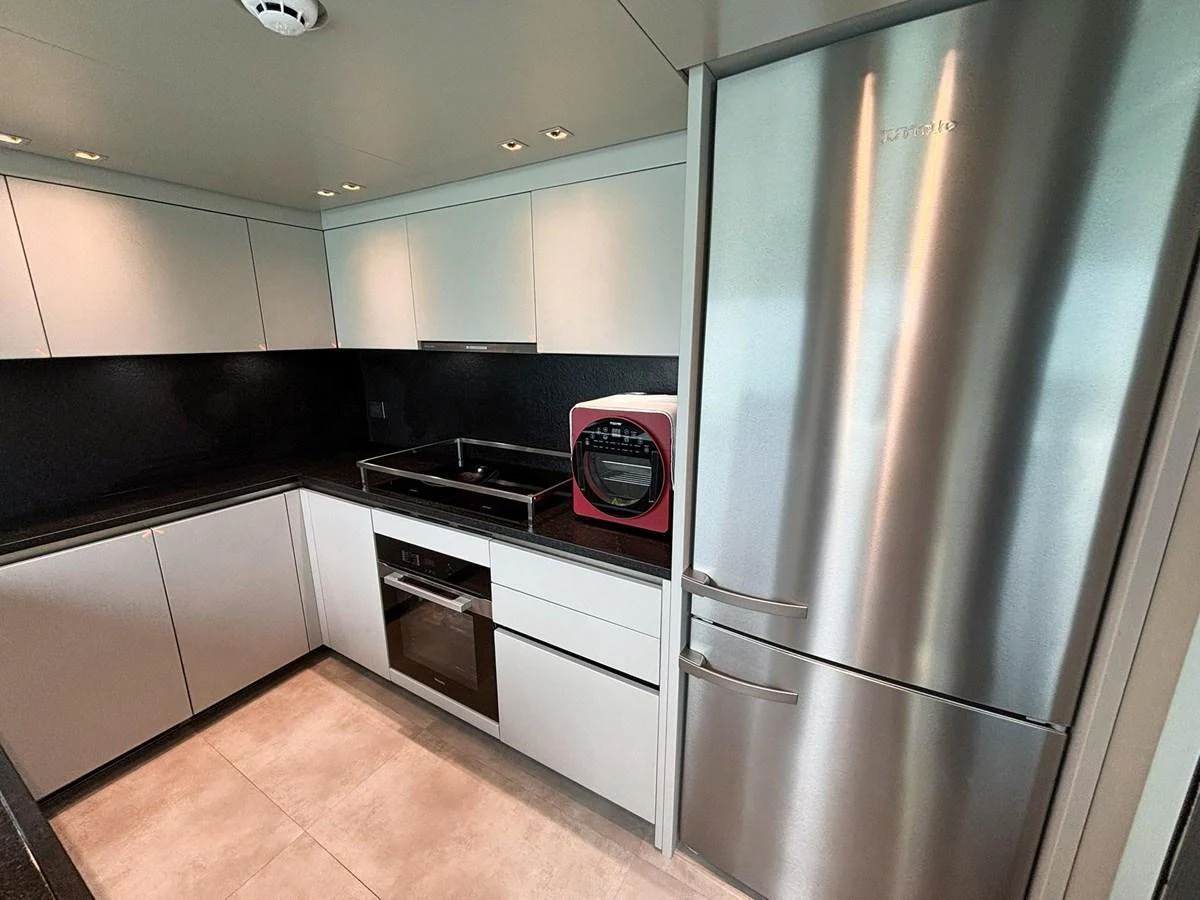 The yacht's galley features modern appliances and sleek cabinetry for a stylish and functional cooking space. aboard SANLORENZO SX88 Yacht for Sale