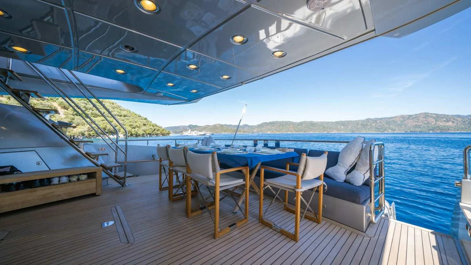 The aft deck offers a spacious and inviting outdoor dining area with stunning views of the surrounding waters. aboard SILVER Yacht for Sale