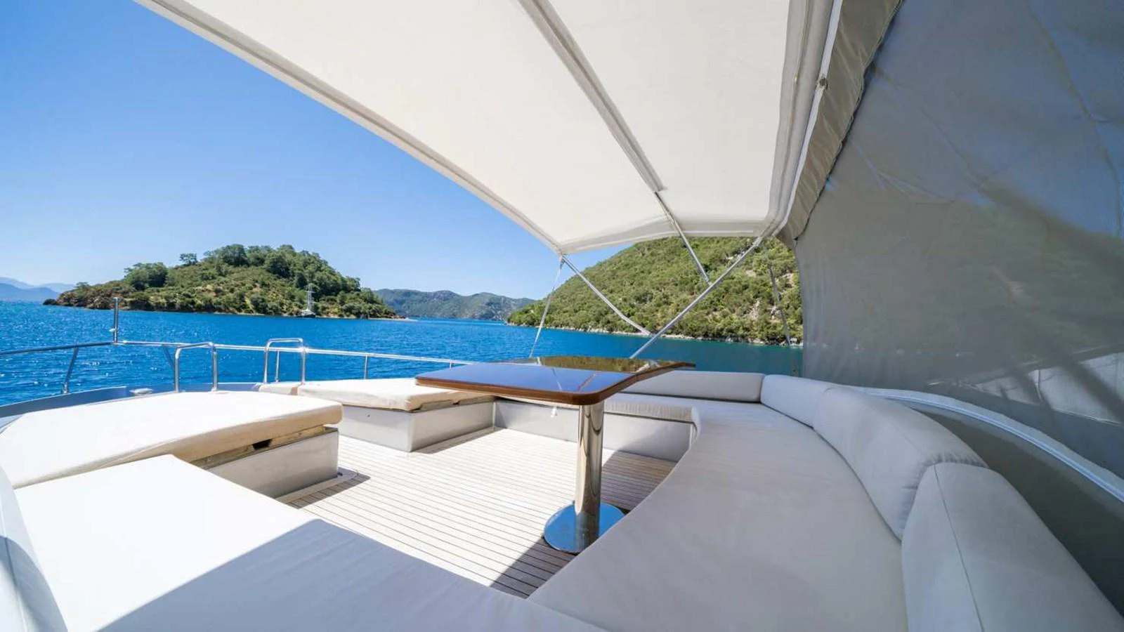The aft deck offers a spacious and shaded lounging area with stunning views of the surrounding waters. aboard SILVER Yacht for Sale
