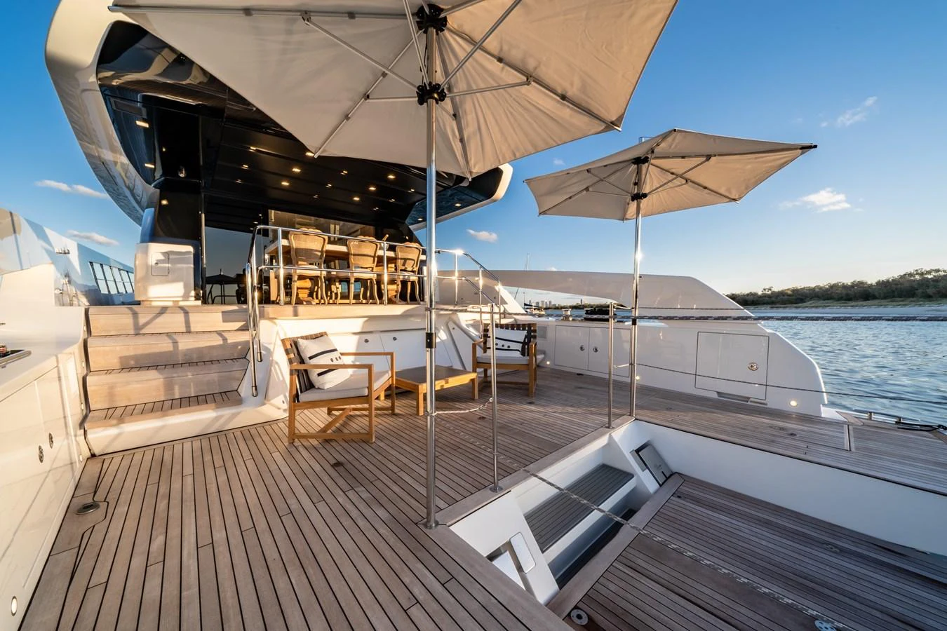 The aft deck offers a spacious and inviting area for relaxation and dining, complete with comfortable seating and sun umbrellas. aboard VIOLETTA Yacht for Sale