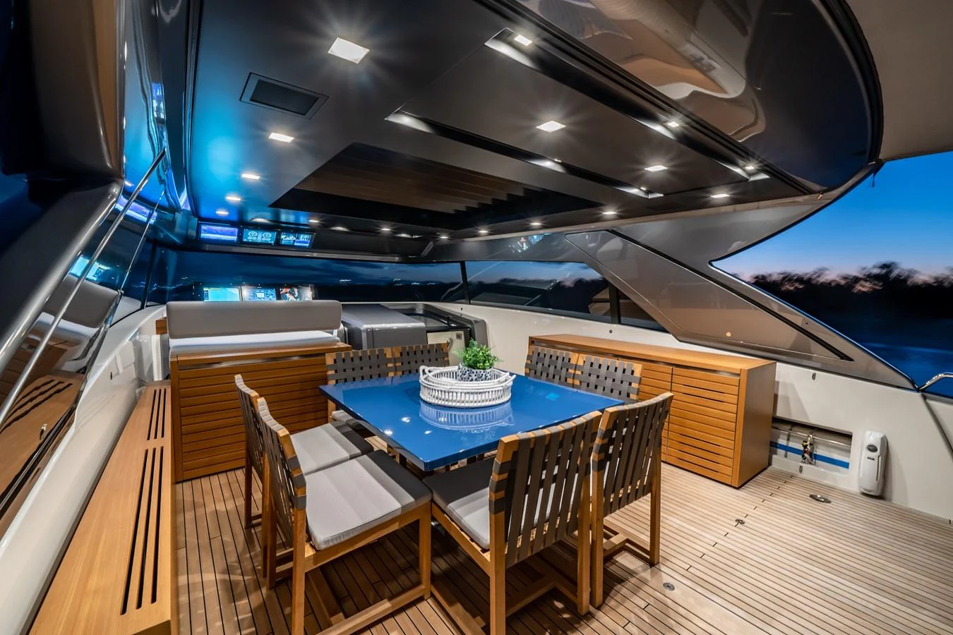 The aft deck features a stylish dining area with a sleek table and comfortable seating, perfect for alfresco meals. aboard VIOLETTA Yacht for Sale