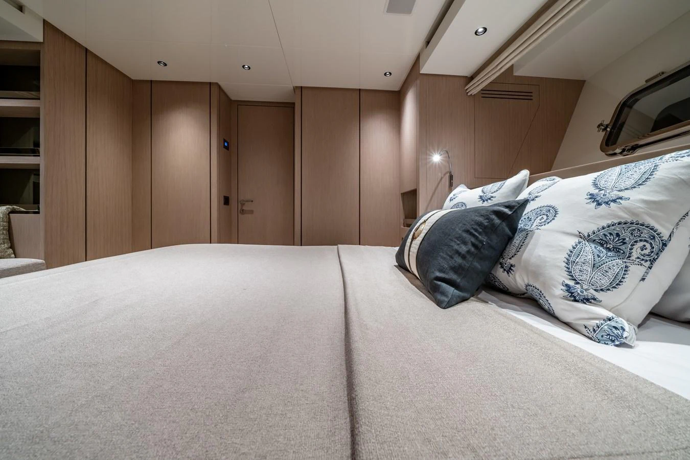 A luxurious stateroom featuring a comfortable bed with elegant bedding and modern lighting. aboard VIOLETTA Yacht for Sale
