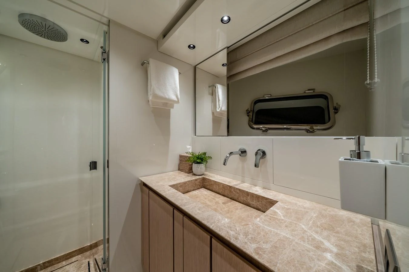 The yacht's bathroom features a sleek design with modern fixtures and a luxurious marble countertop. aboard VIOLETTA Yacht for Sale