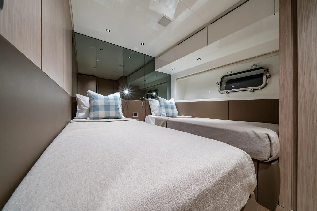 The twin stateroom offers a cozy and modern sleeping area with two single beds and a sleek design. aboard VIOLETTA Yacht for Sale