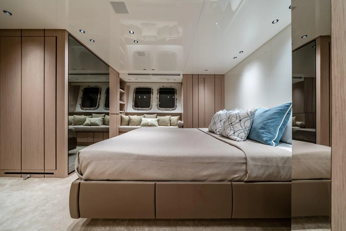 The stateroom features a plush bed with elegant linens and ample natural light from the windows. aboard VIOLETTA Yacht for Sale