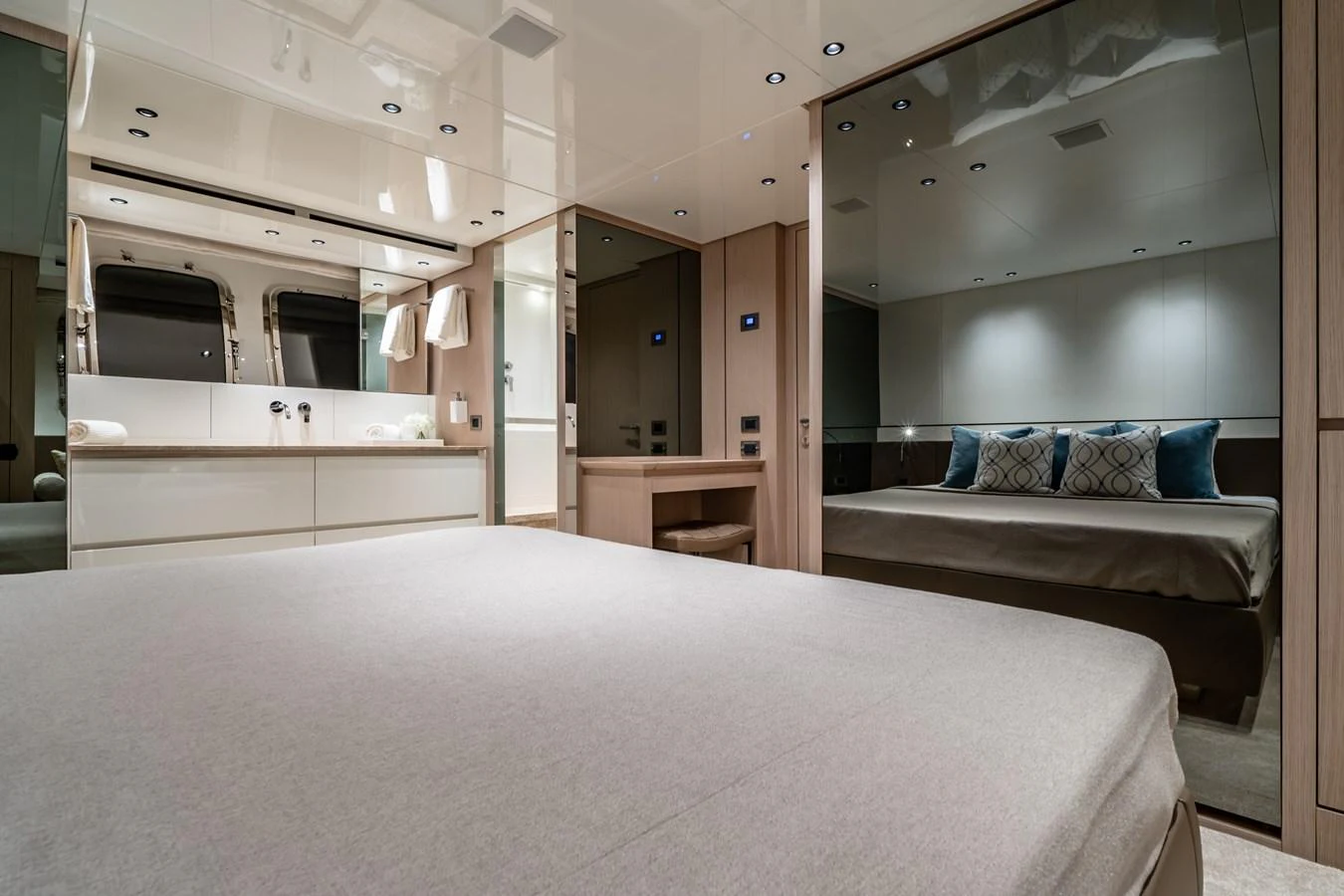 The luxurious stateroom features a spacious bed, elegant decor, and ample lighting. aboard VIOLETTA Yacht for Sale