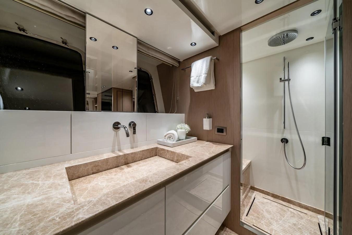 The yacht's bathroom features a sleek design with a spacious shower and elegant fixtures. aboard VIOLETTA Yacht for Sale