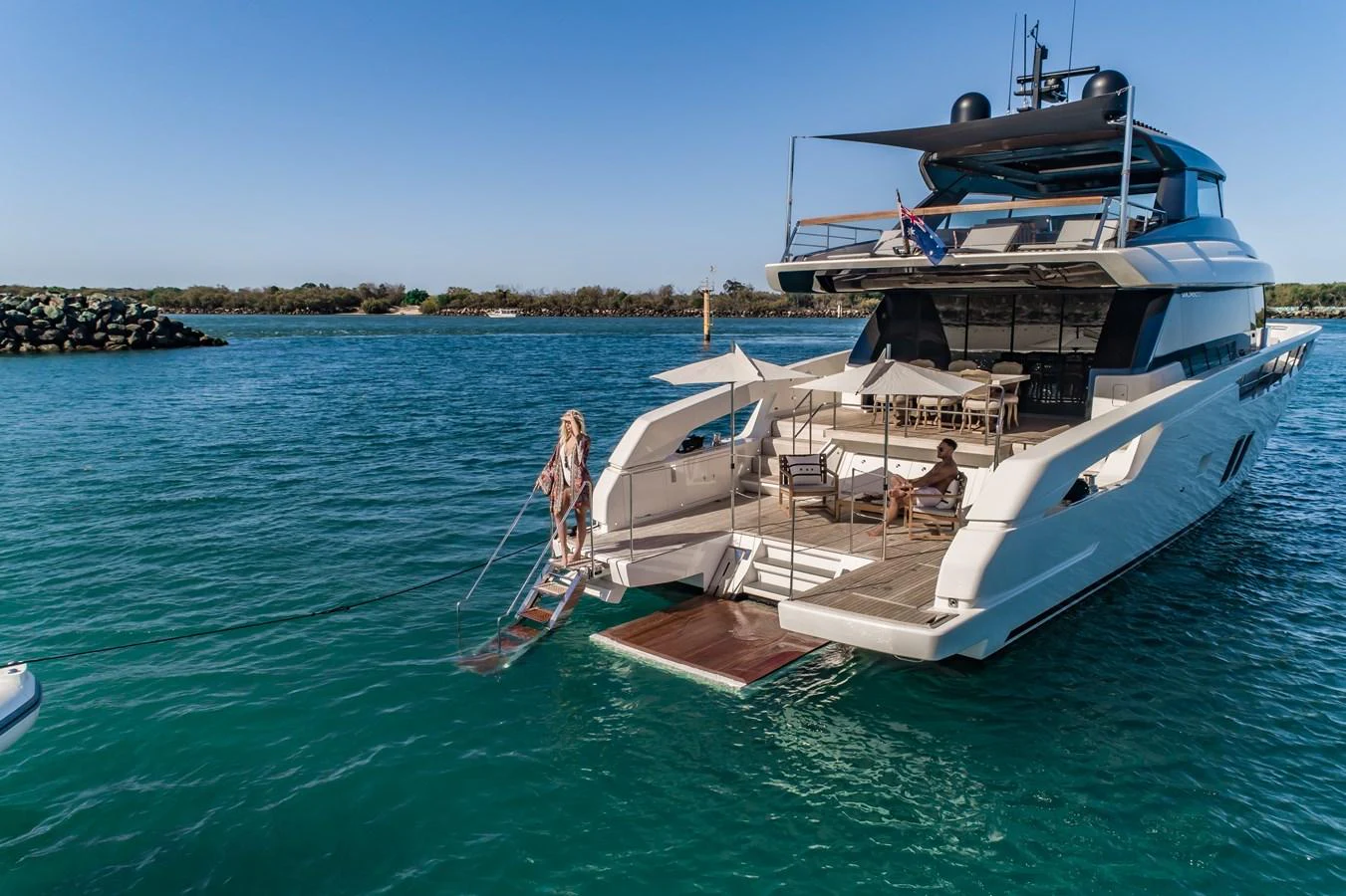 The yacht's aft deck features a spacious lounging area with easy access to the water. aboard VIOLETTA Yacht for Sale