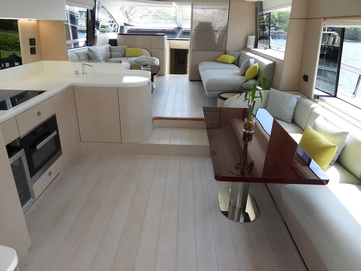 The spacious salon features modern furnishings and ample natural light. aboard EFFORTLESS Yacht for Sale