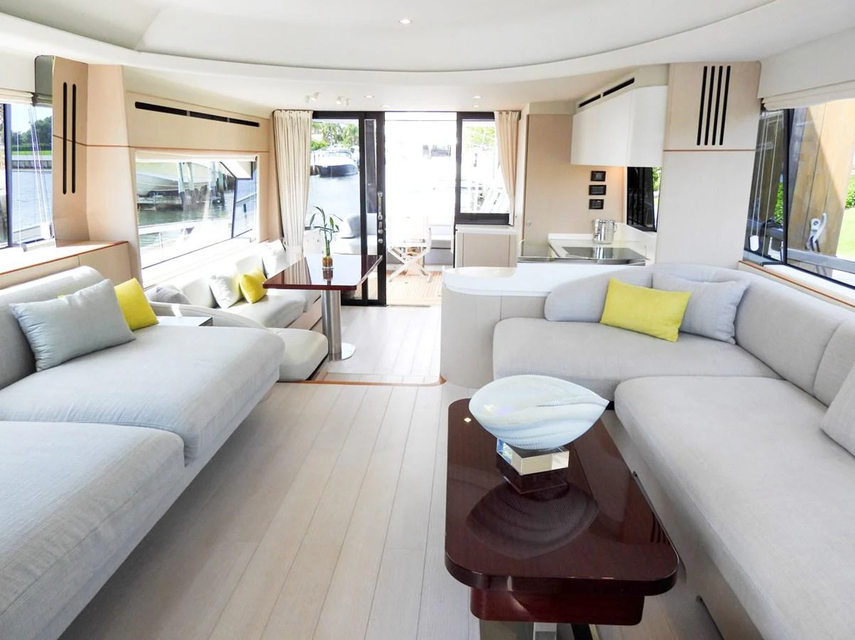 The salon features spacious seating with modern decor and ample natural light. aboard EFFORTLESS Yacht for Sale