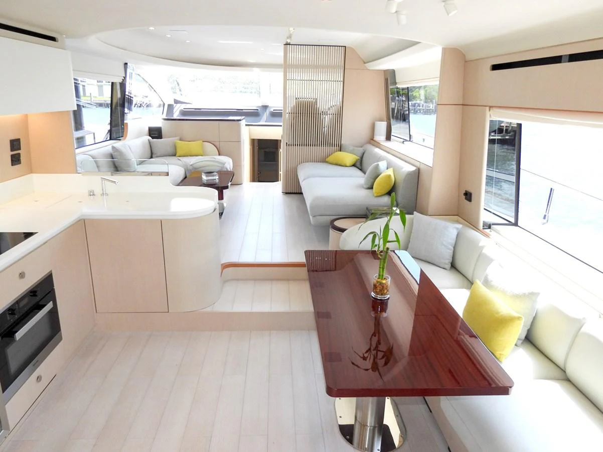 The salon features a spacious and modern design with ample seating and natural light. aboard EFFORTLESS Yacht for Sale