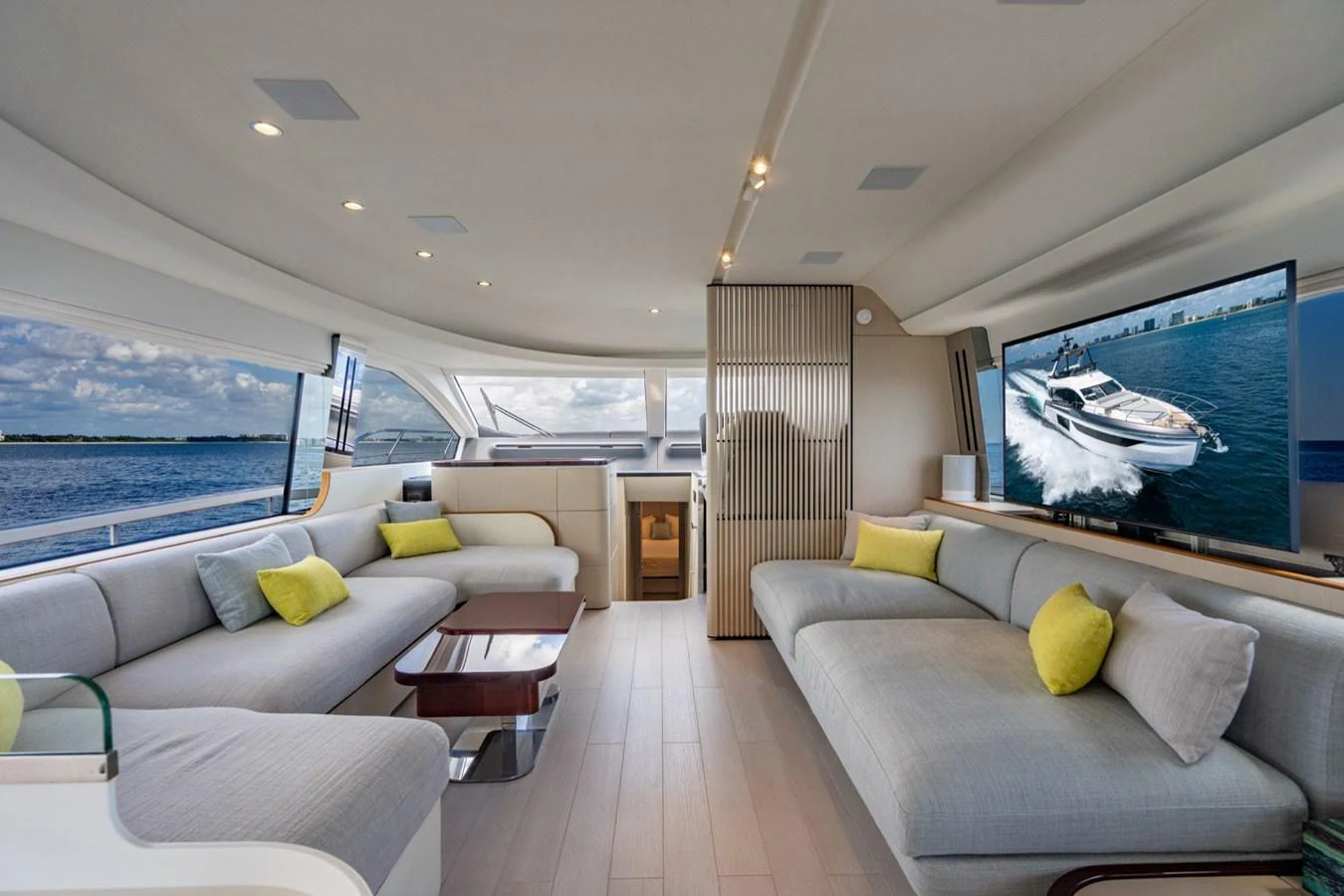The salon offers a spacious and modern seating area with panoramic views. aboard EFFORTLESS Yacht for Sale