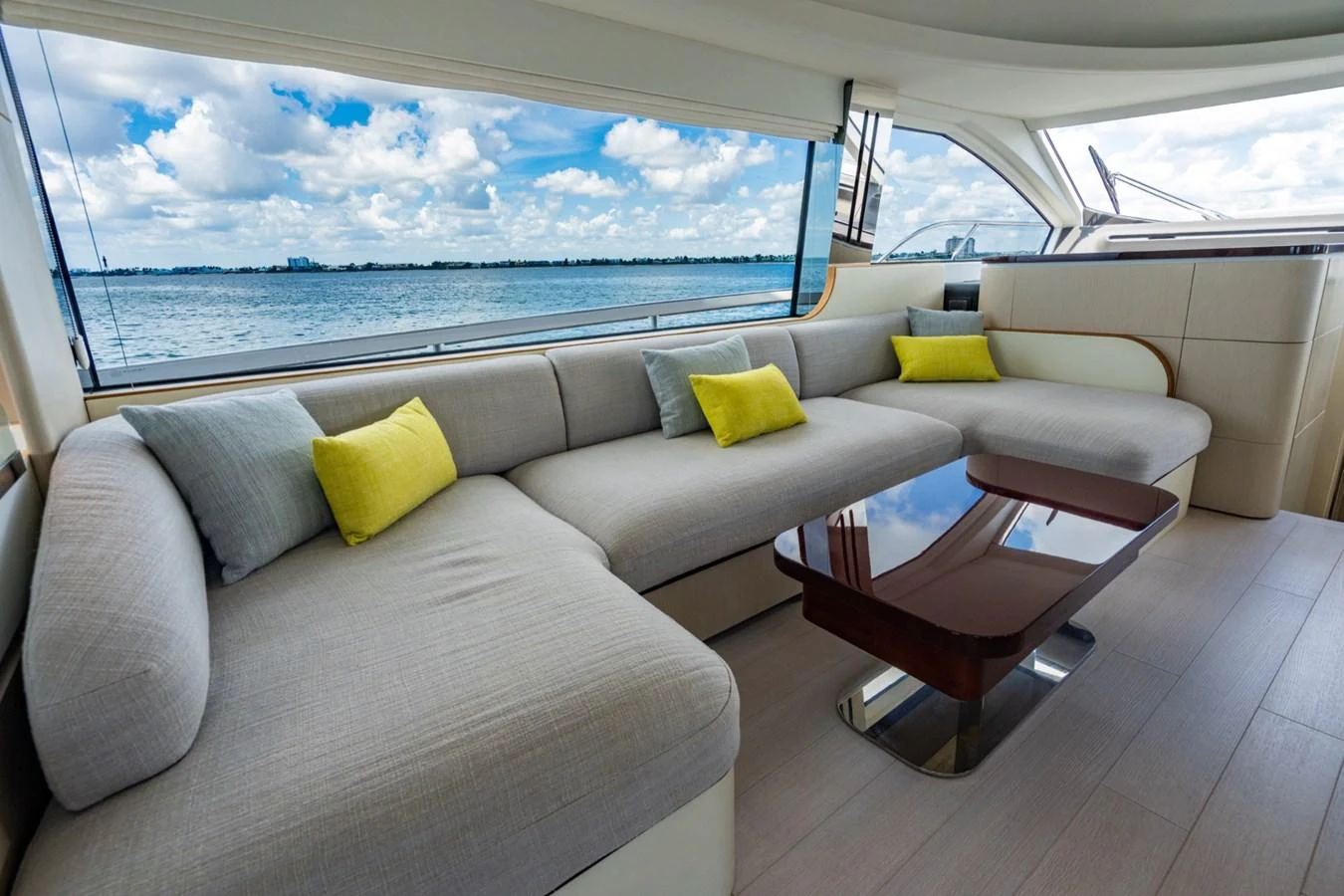 The salon features a spacious and comfortable seating area with panoramic views of the water. aboard EFFORTLESS Yacht for Sale