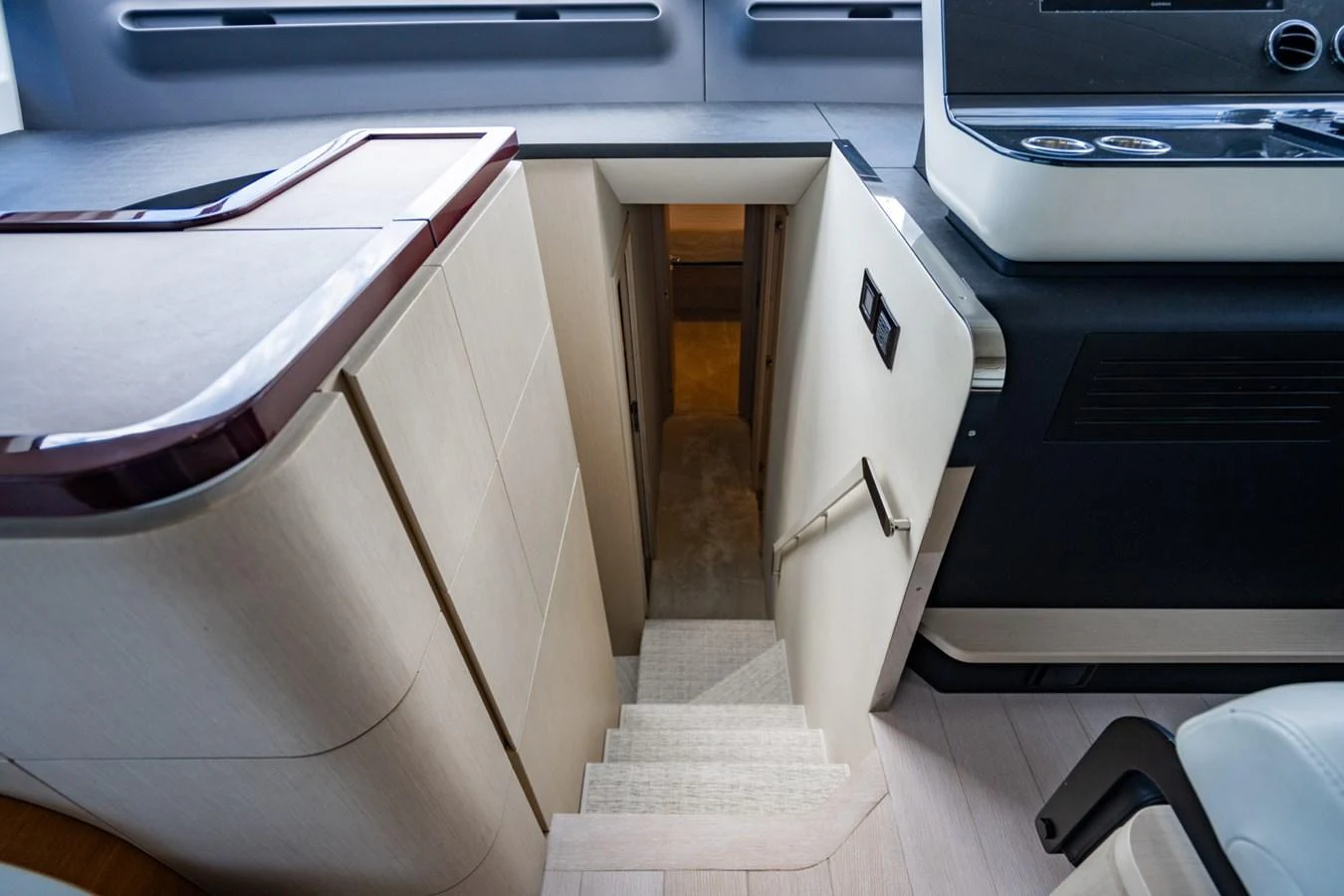 A sleek interior staircase leading to the lower deck of the yacht. aboard EFFORTLESS Yacht for Sale