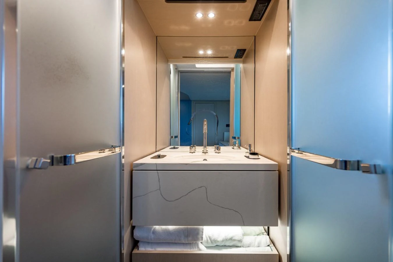 A sleek and modern bathroom with a minimalist design and ample lighting. aboard EFFORTLESS Yacht for Sale