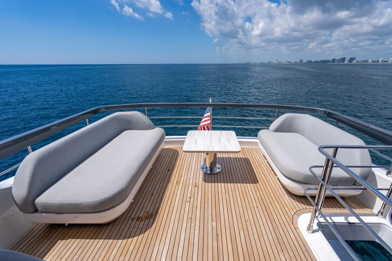 The aft deck offers a serene seating area with panoramic ocean views. aboard EFFORTLESS Yacht for Sale