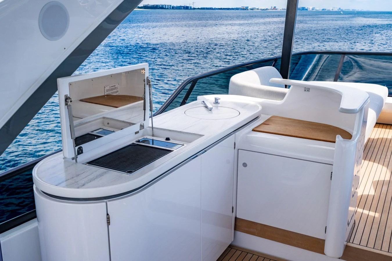The outdoor galley offers a sleek and functional space for alfresco dining with stunning water views. aboard EFFORTLESS Yacht for Sale