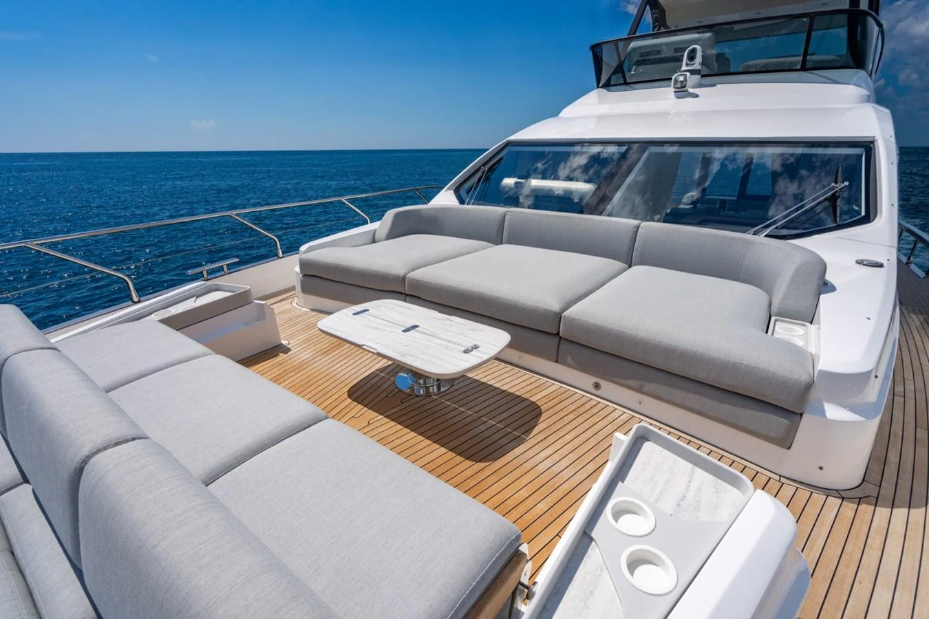 The aft deck features luxurious seating with a stunning ocean view. aboard EFFORTLESS Yacht for Sale