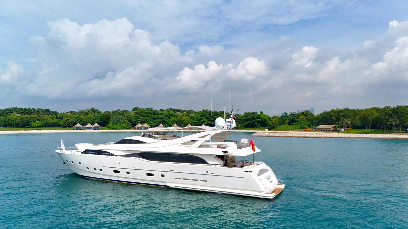 A sleek white yacht cruises gracefully on calm waters under a partly cloudy sky. aboard CUSTOM LINE 112 Yacht for Sale