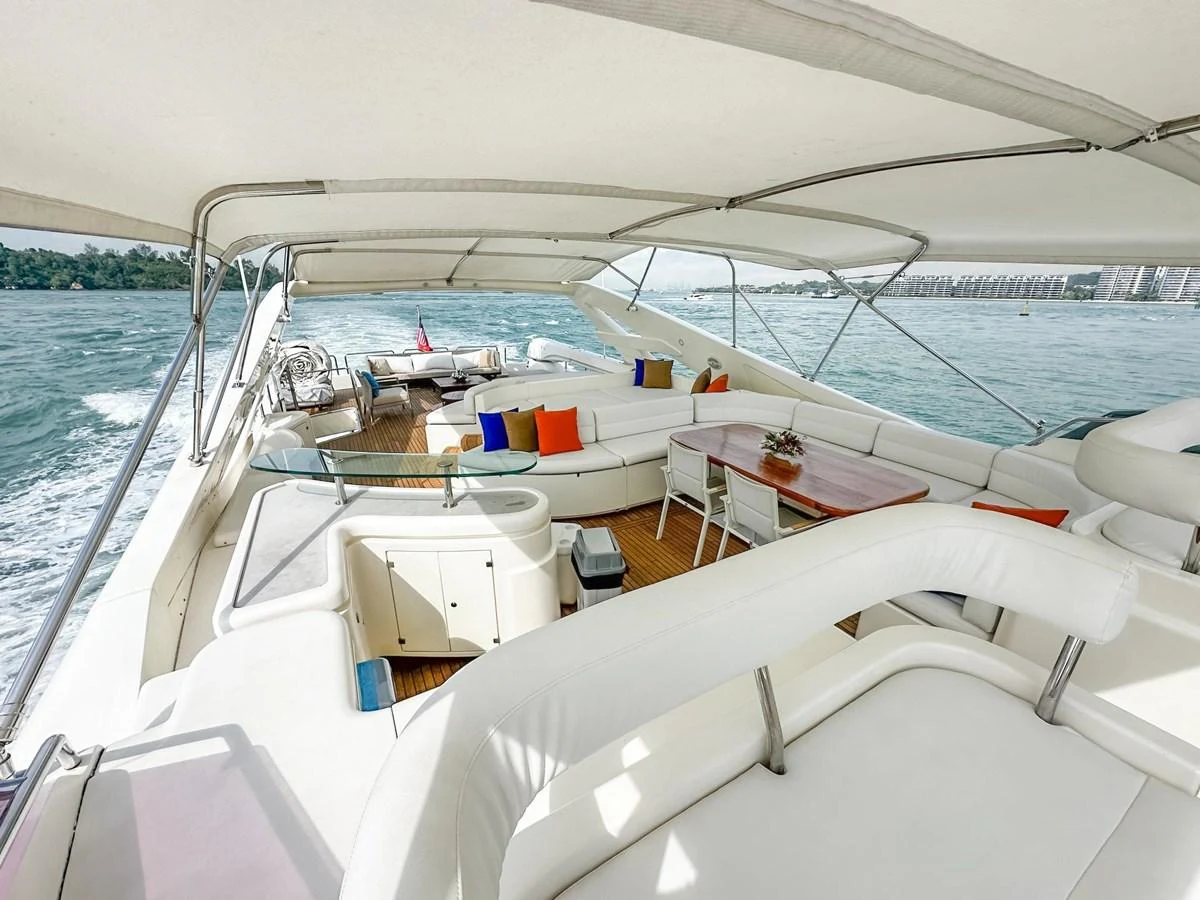 The spacious flybridge offers ample seating and a stunning view of the surrounding waters. aboard CUSTOM LINE 112 Yacht for Sale