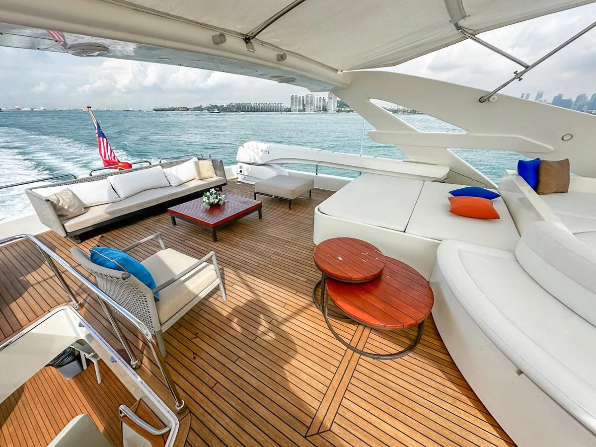 The aft deck offers a spacious and stylish outdoor lounging area with comfortable seating and a beautiful view of the water. aboard CUSTOM LINE 112 Yacht for Sale