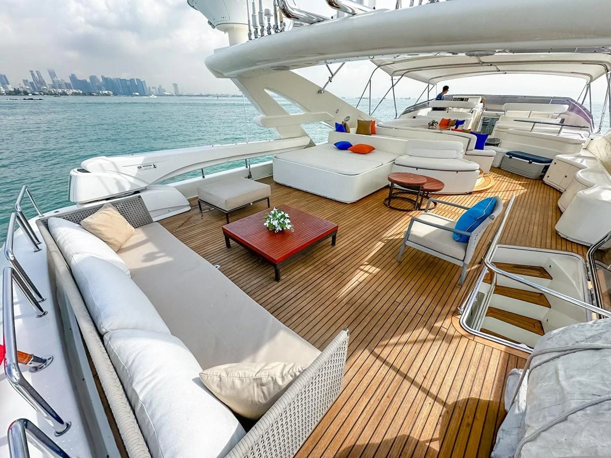 The spacious flybridge offers luxurious seating and stunning views, perfect for relaxation and entertainment. aboard CUSTOM LINE 112 Yacht for Sale