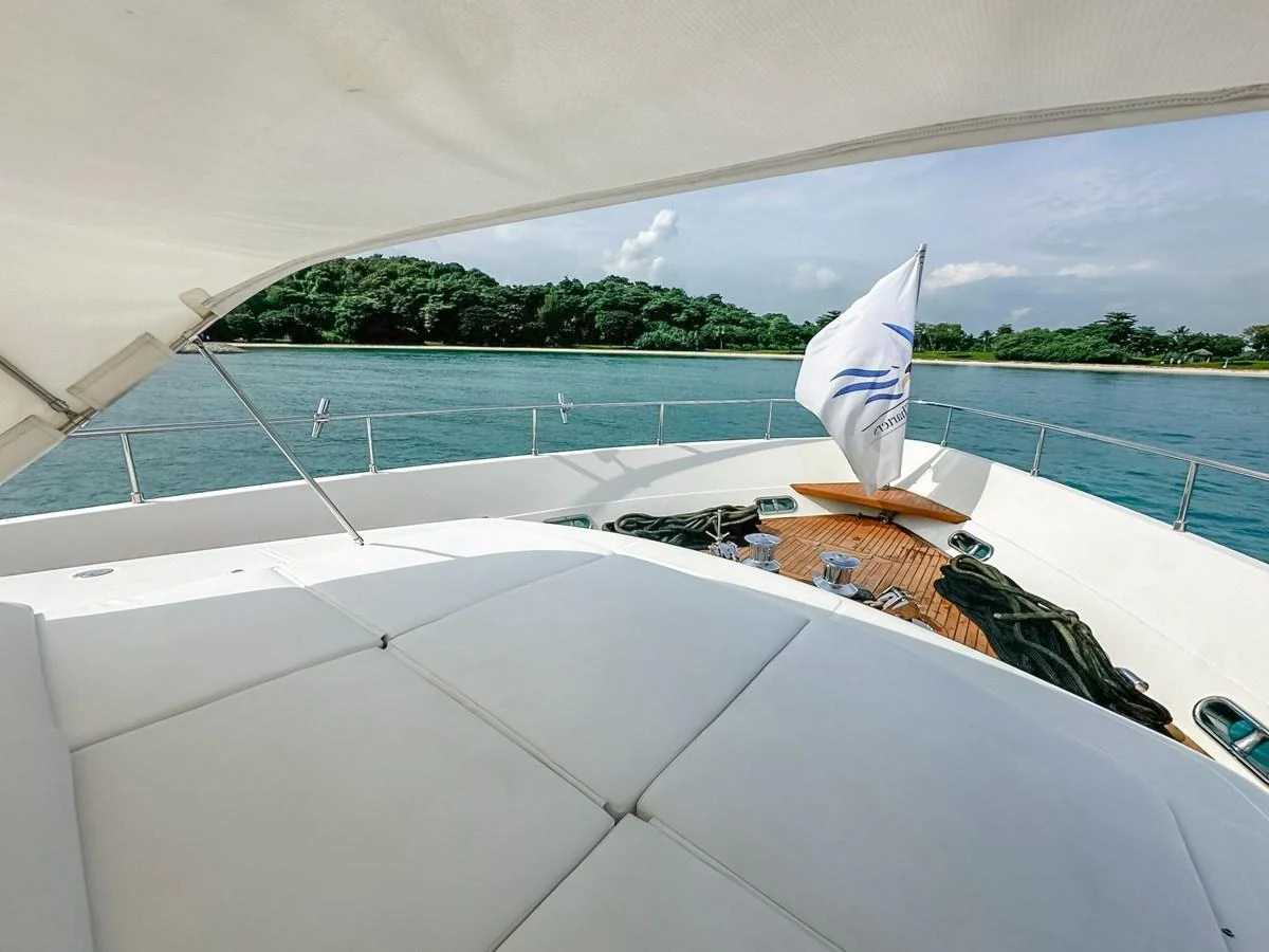 The foredeck offers a spacious sunbathing area with a scenic view of the water and shoreline. aboard CUSTOM LINE 112 Yacht for Sale