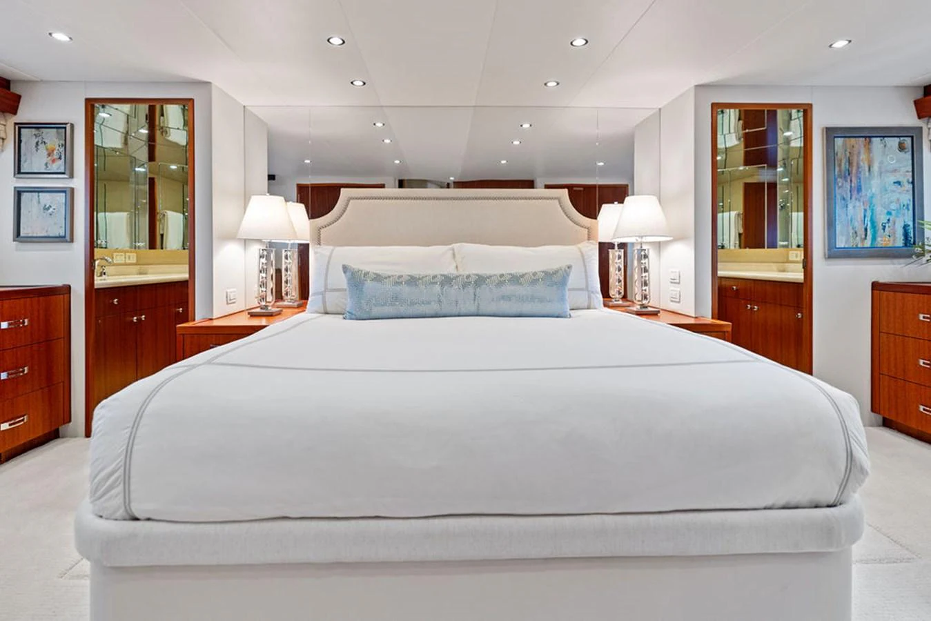 The master stateroom features a luxurious bed with elegant decor and ample storage. aboard GRIFFIN Yacht for Sale