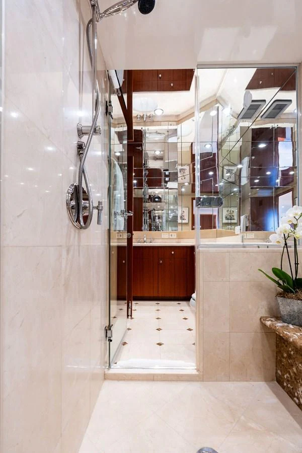 The yacht's bathroom features elegant marble finishes and modern fixtures. aboard GRIFFIN Yacht for Sale