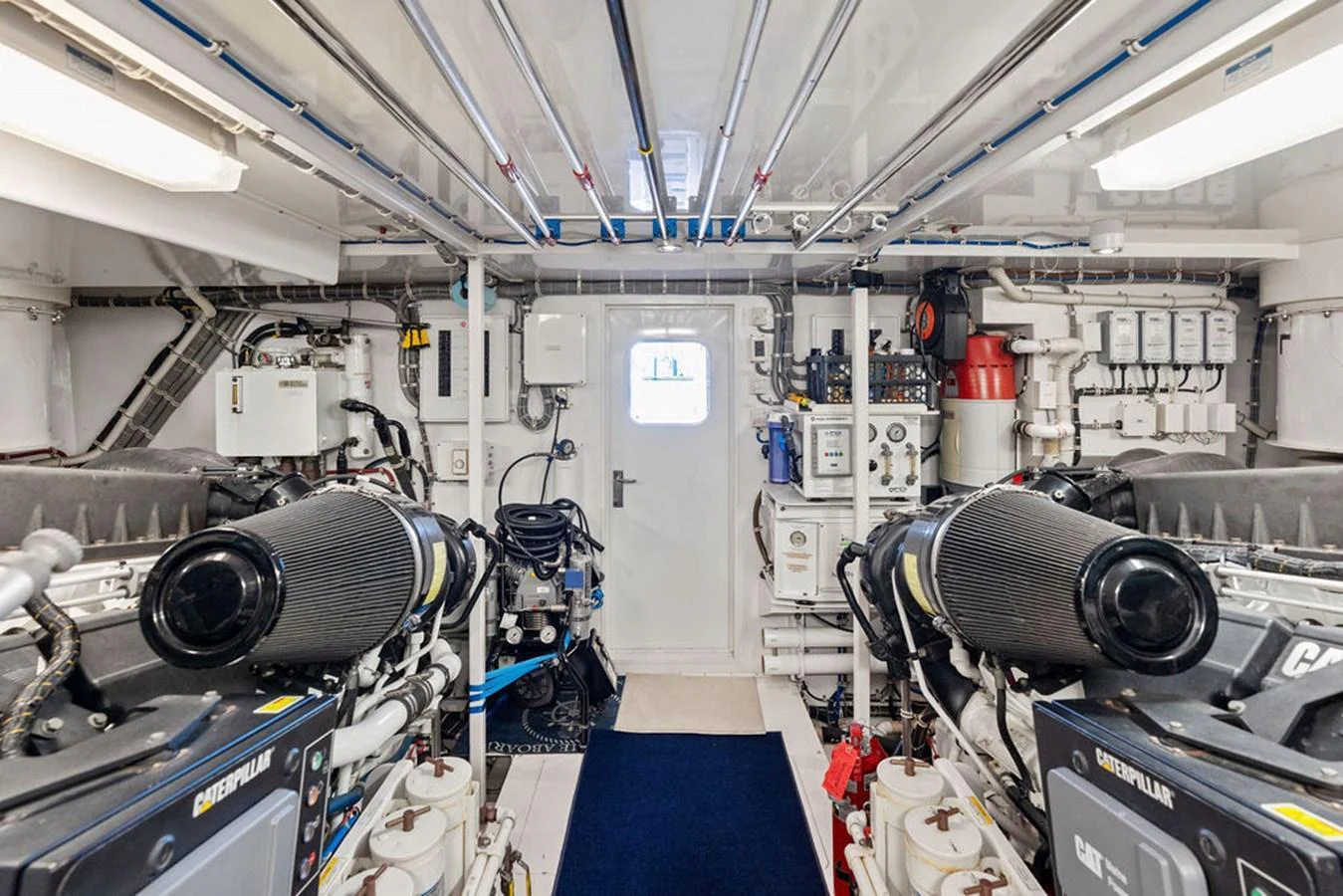 The engine room is meticulously organized, showcasing powerful machinery and advanced systems. aboard GRIFFIN Yacht for Sale