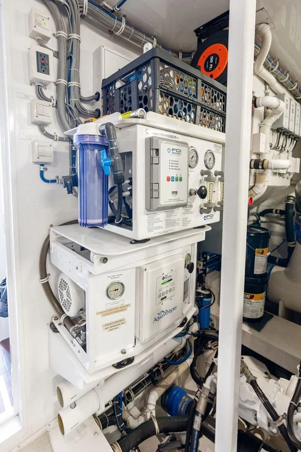The image showcases the technical equipment and machinery in the yacht's engine room. aboard GRIFFIN Yacht for Sale