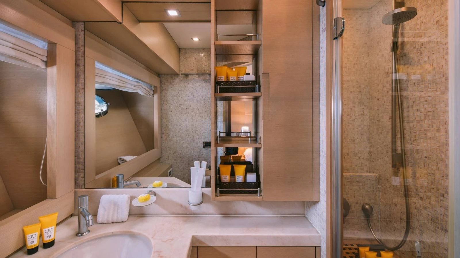 The yacht's bathroom features a sleek design with modern fixtures and ample storage space. aboard THIS IS MINE Yacht for Sale