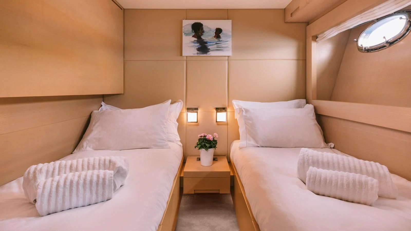 The guest stateroom features twin beds with plush linens and a cozy ambiance. aboard THIS IS MINE Yacht for Sale