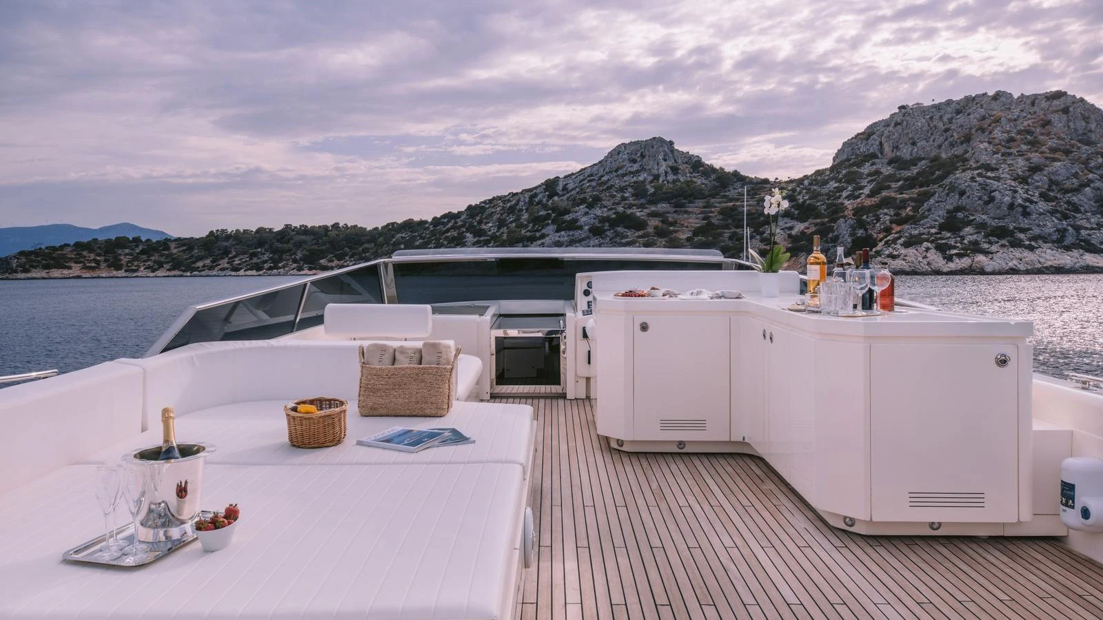 The sundeck offers a luxurious space with comfortable seating and a well-equipped bar, perfect for relaxation and entertaining. aboard THIS IS MINE Yacht for Sale