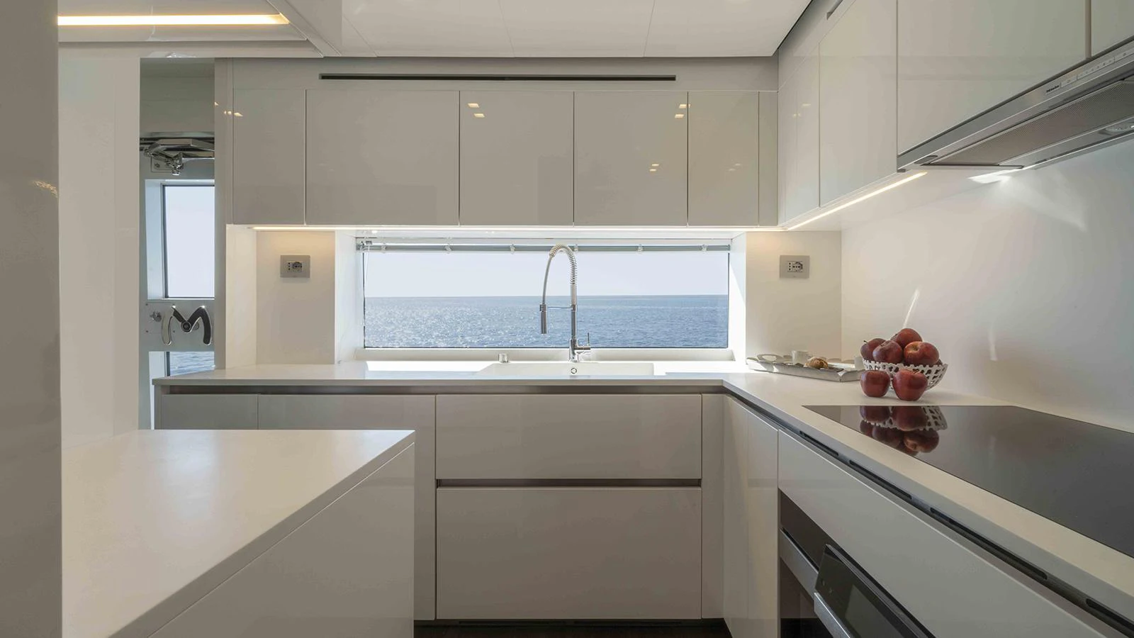 a kitchen with white cabinets aboard FOUR JOYS Yacht for Sale