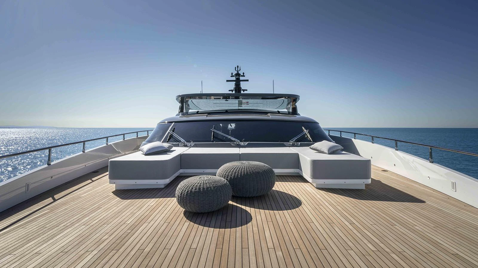 a white car on a wooden dock aboard FOUR JOYS Yacht for Sale