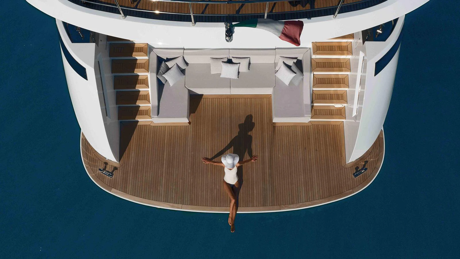 a person standing on a wooden floor aboard FOUR JOYS Yacht for Sale