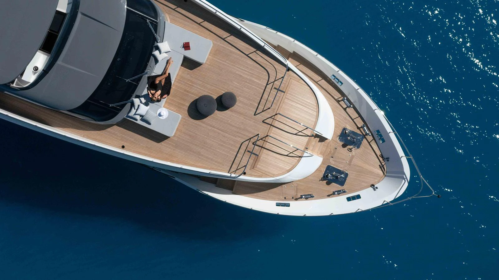 a person on a computer aboard FOUR JOYS Yacht for Sale