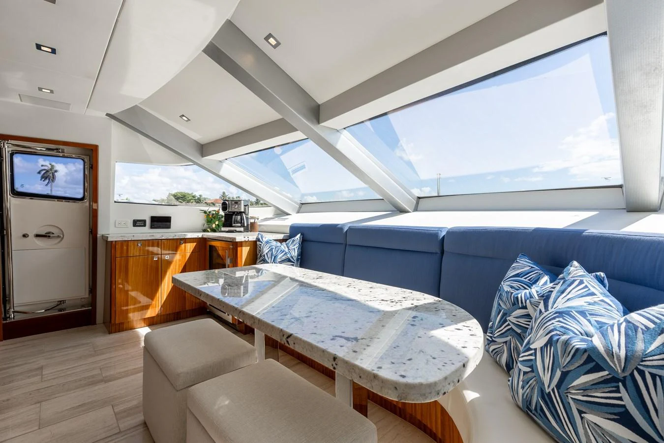 The salon features a spacious seating area with large windows providing ample natural light. aboard RITZ SEA Yacht for Sale