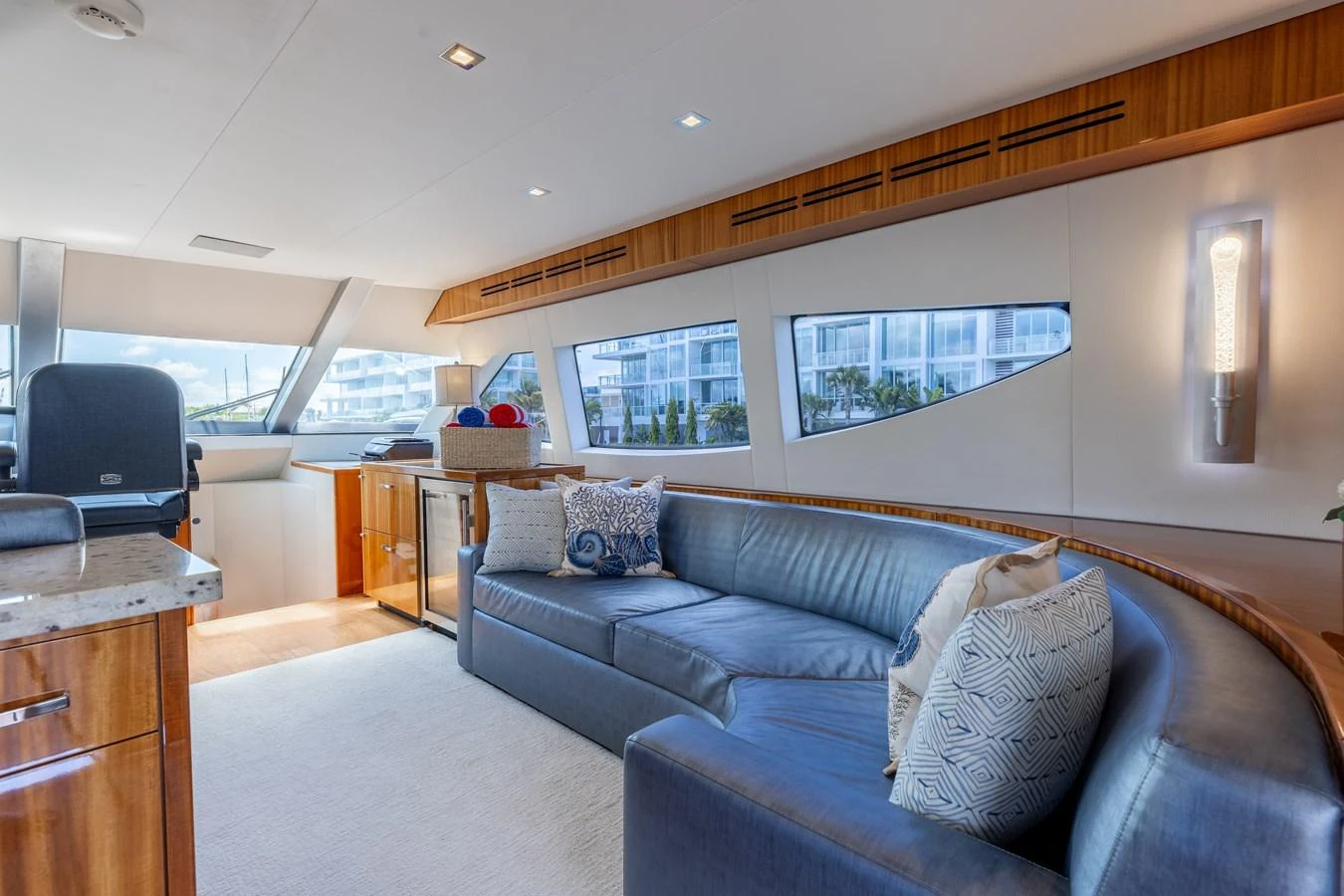 The yacht's salon features a comfortable seating area with large windows providing ample natural light. aboard RITZ SEA Yacht for Sale