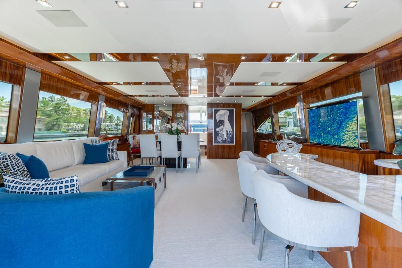 The salon features luxurious seating, a dining area, and large windows for panoramic views. aboard RITZ SEA Yacht for Sale