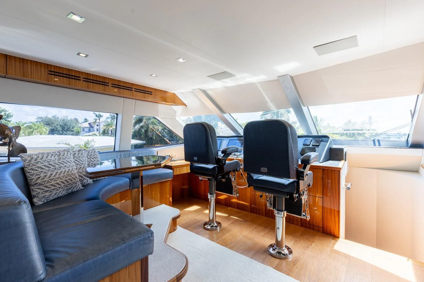 The yacht's helm area features modern seating and a spacious, well-lit environment with large windows offering excellent visibility. aboard RITZ SEA Yacht for Sale