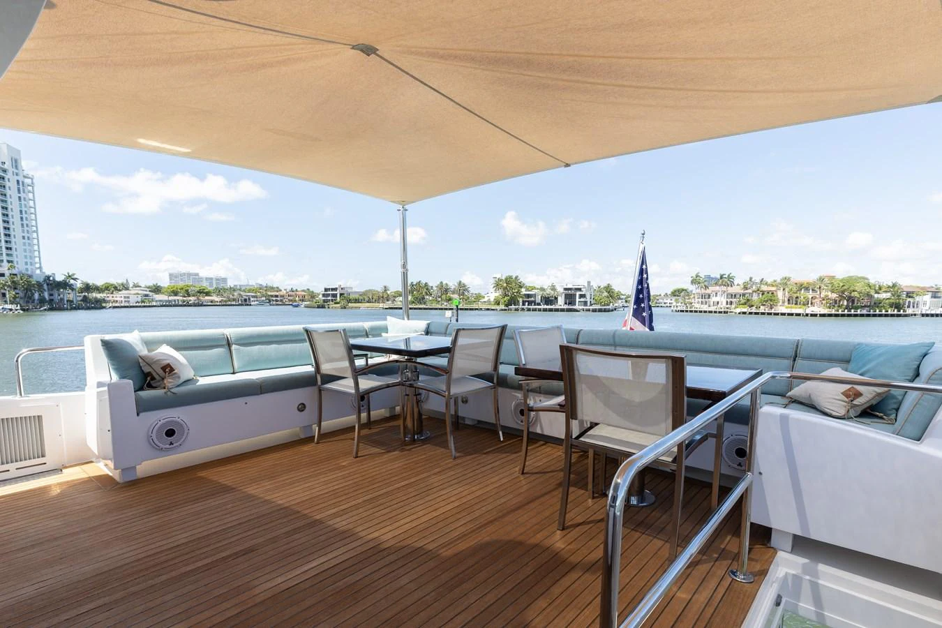The aft deck offers a spacious and inviting area for relaxation and dining with a scenic view. aboard RITZ SEA Yacht for Sale